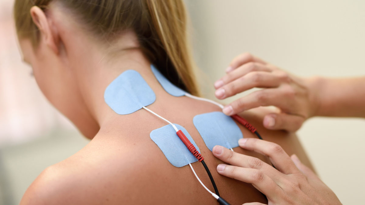 A woman recieves nerve stimulation therapy to treat pain.