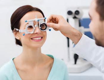 A woman getting an eye exam.