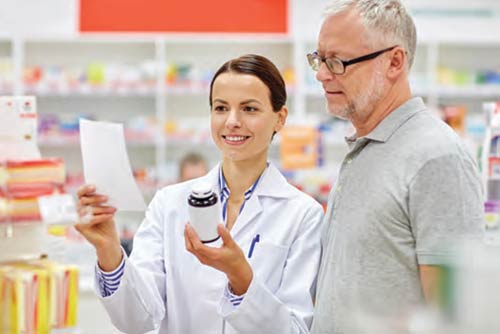 a pharmacist answering a patient's questions