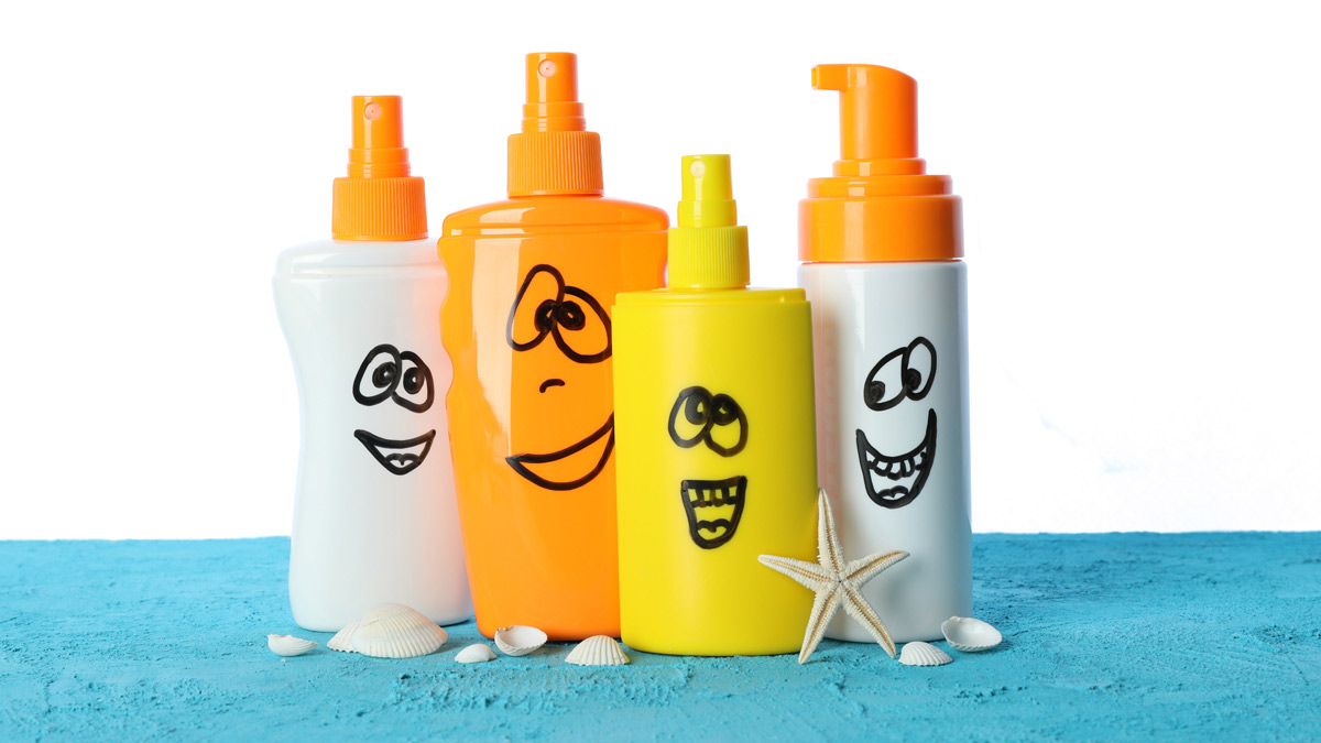 -Plastic bottles of sunscreen with smiles-