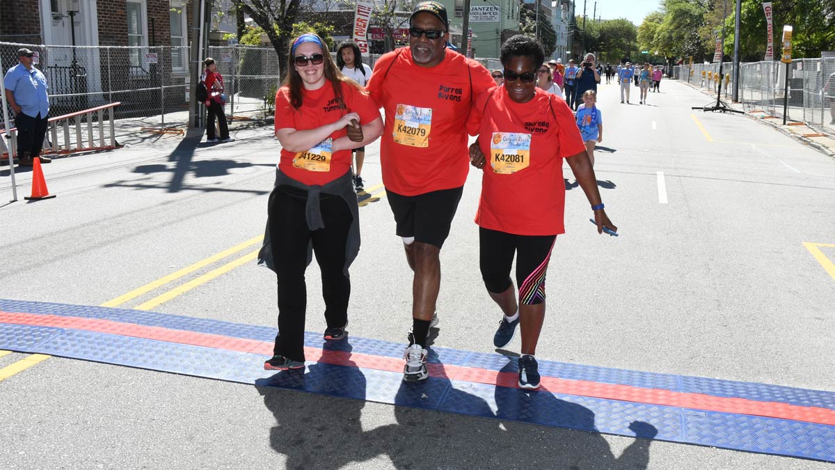 Darrell Bivens crossing the finish line of the Cooper River Bridge Run