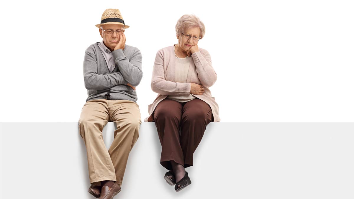 A depressed-looking older couple.