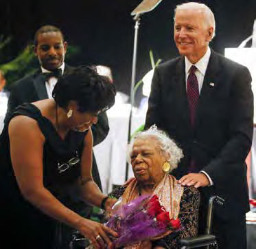Dot Scott, president of the Charleston NAACP branch, talks with Earsie Jackson and former Vice President Joe Biden.