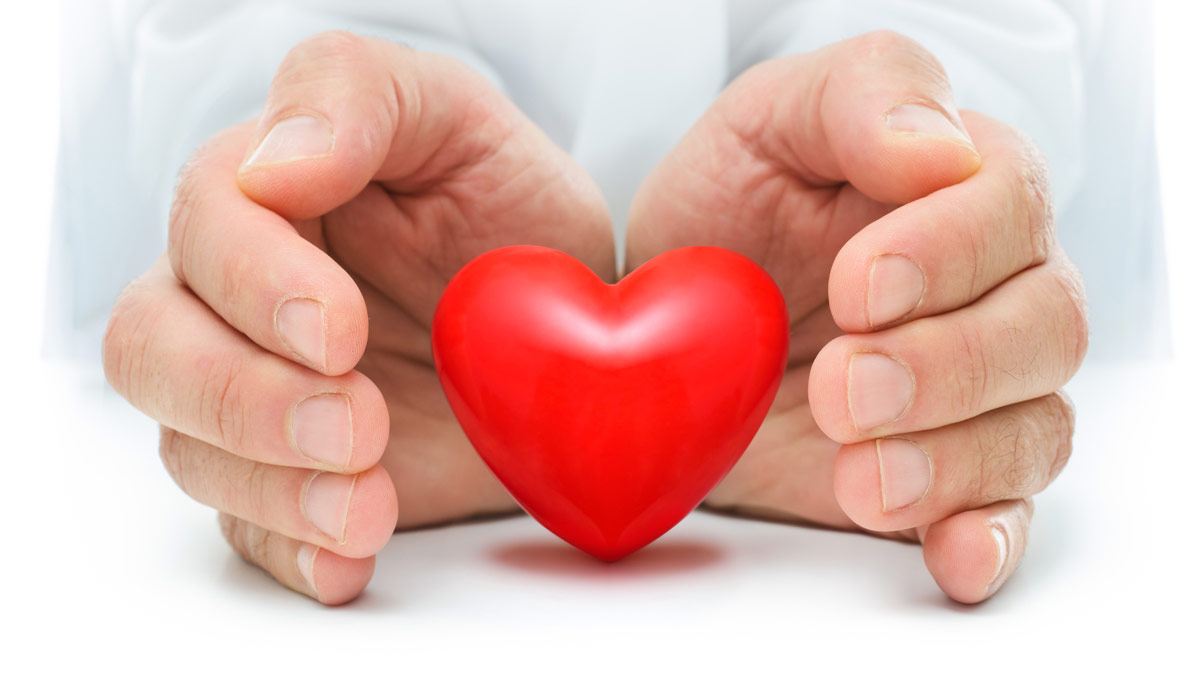 Hands surrounding a heart. Organ Donation article image.