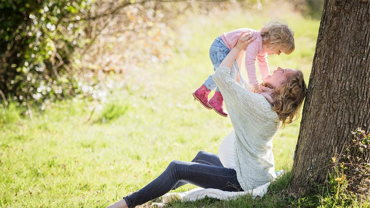 Photo of a mother with her young daughter. Care for yourself so you can care for others.