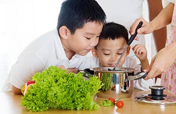 kids smelling mom's cooking