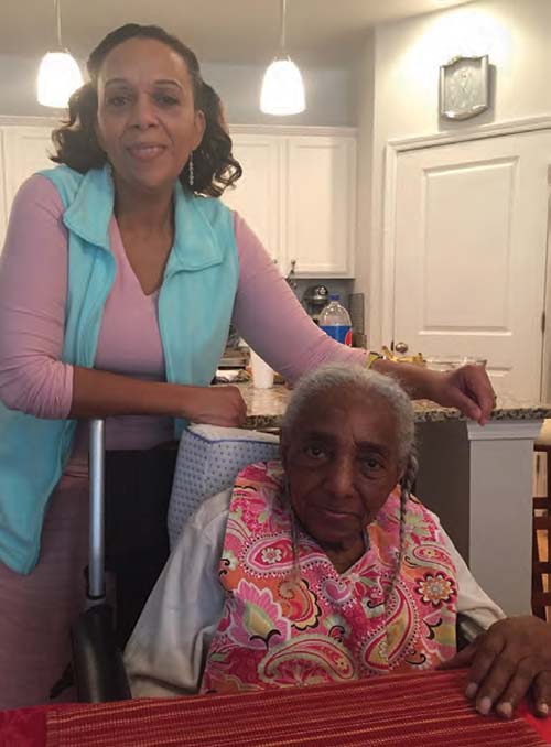 A caregiver with her elderly loved one.