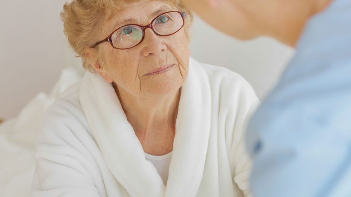 An Alzheimer's patient with her care provider.