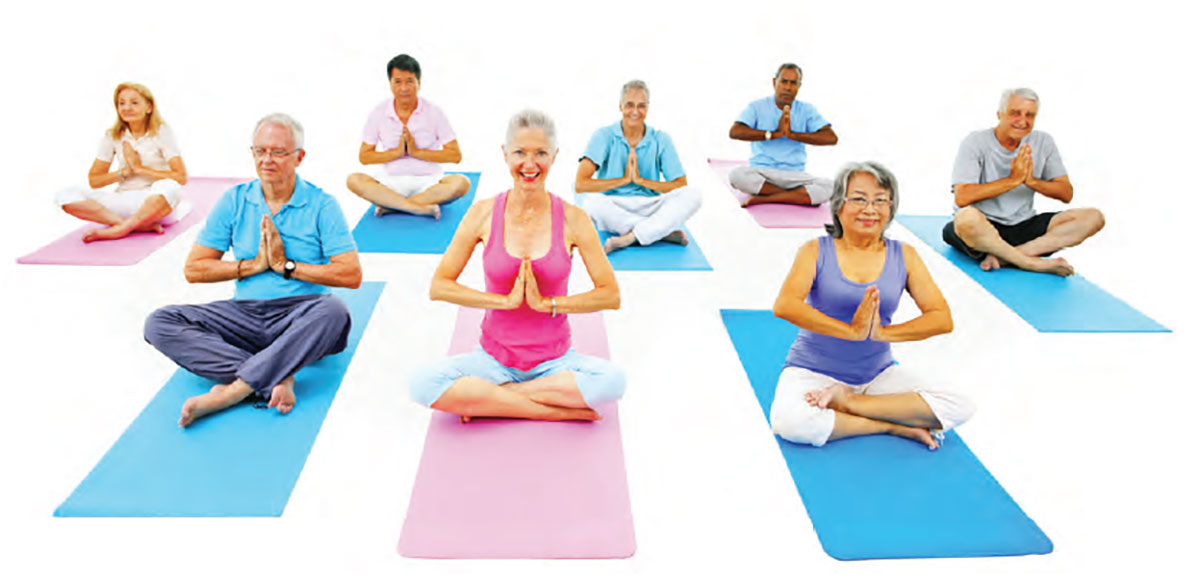 Seniors taking a yoga class