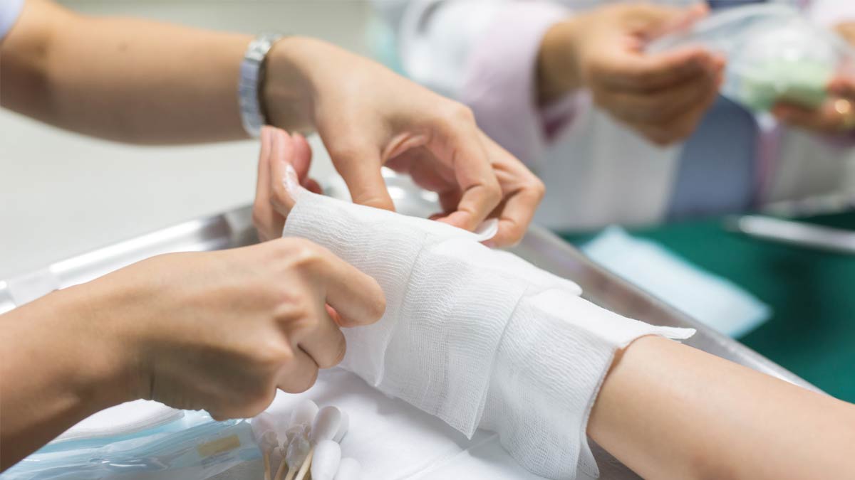 A patient recieves treatment for a burn.