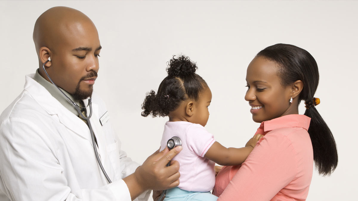 An African American mother with her baby at the doctor's office