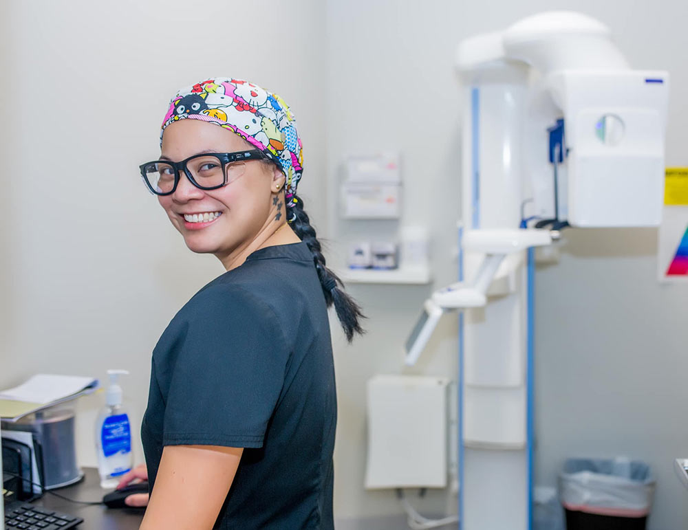 A smiling staff member at Charleston Oral and Facial Surgery