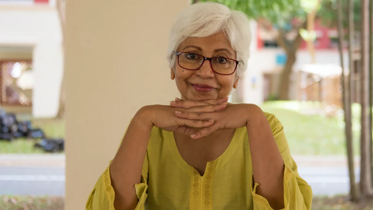 An older woman smiling.