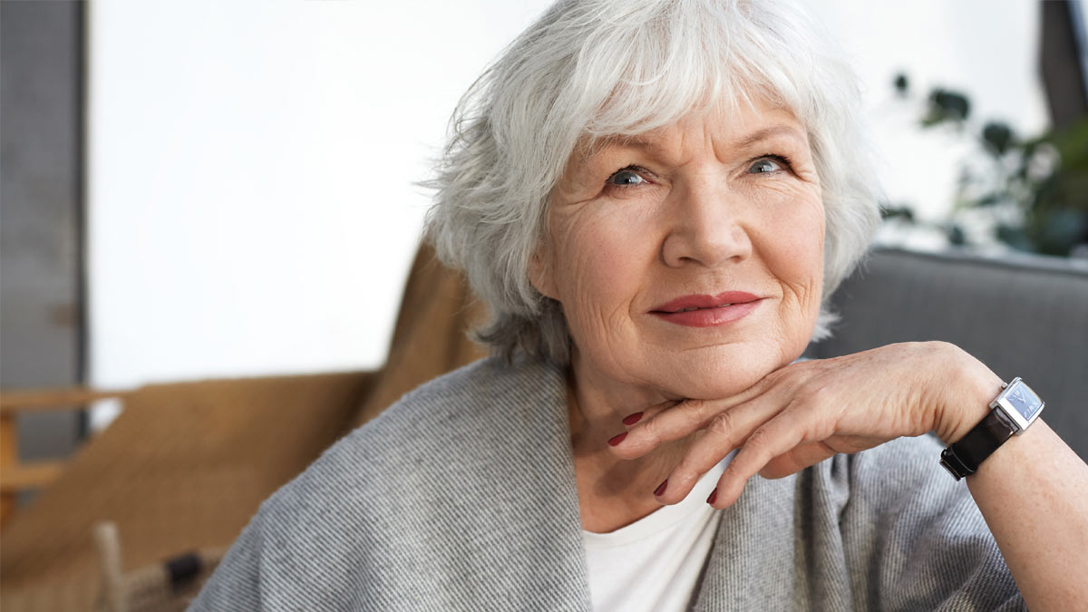 A woman thinking about hear health.