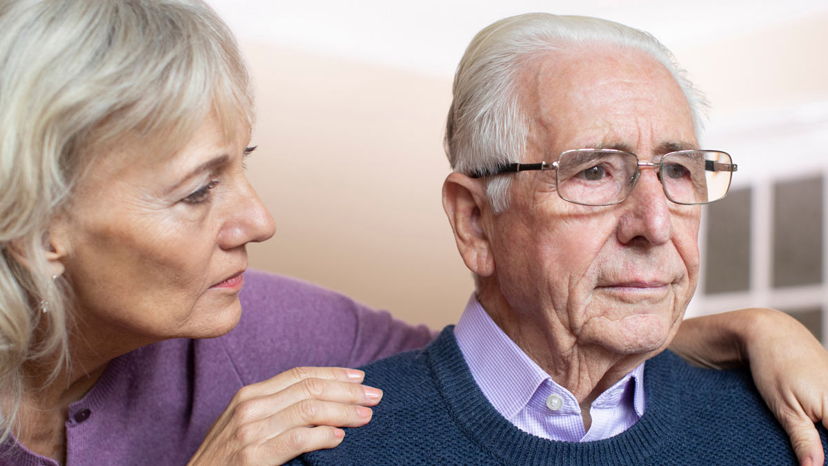 A woman cares for a disabled family member.