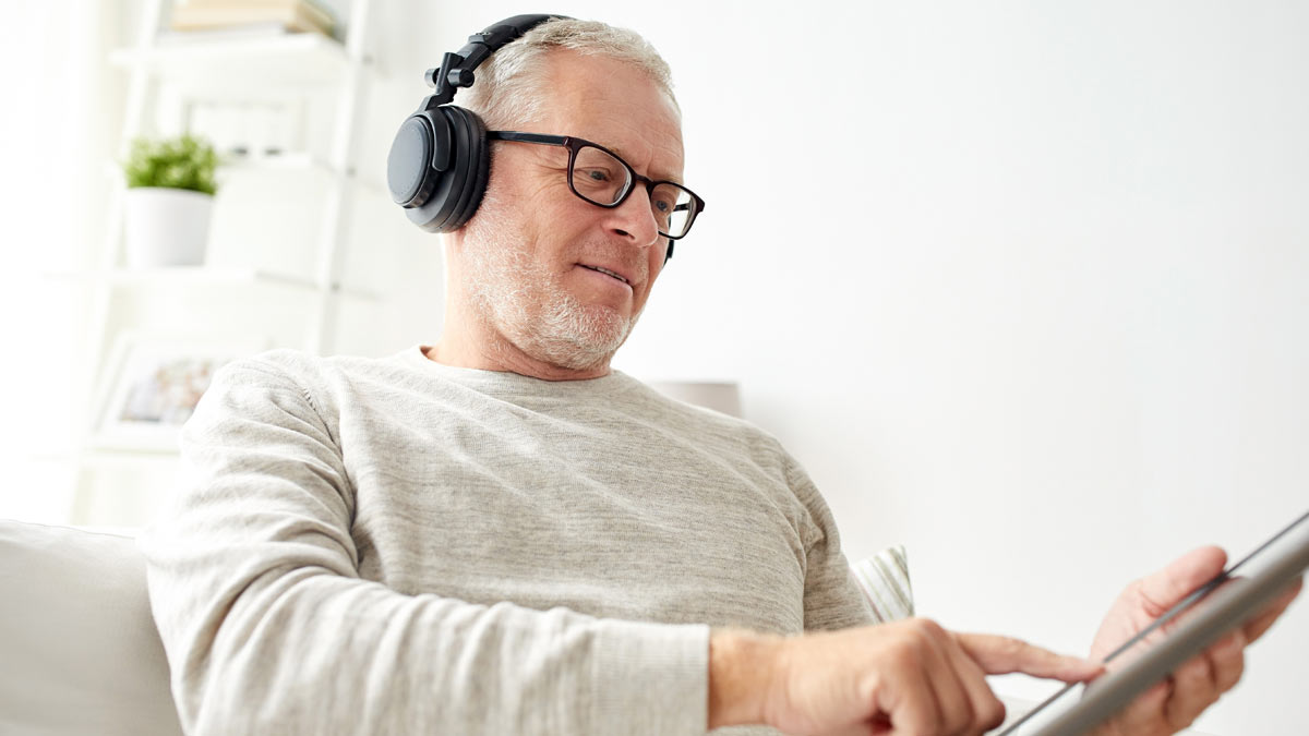 A man listening to a podcast.