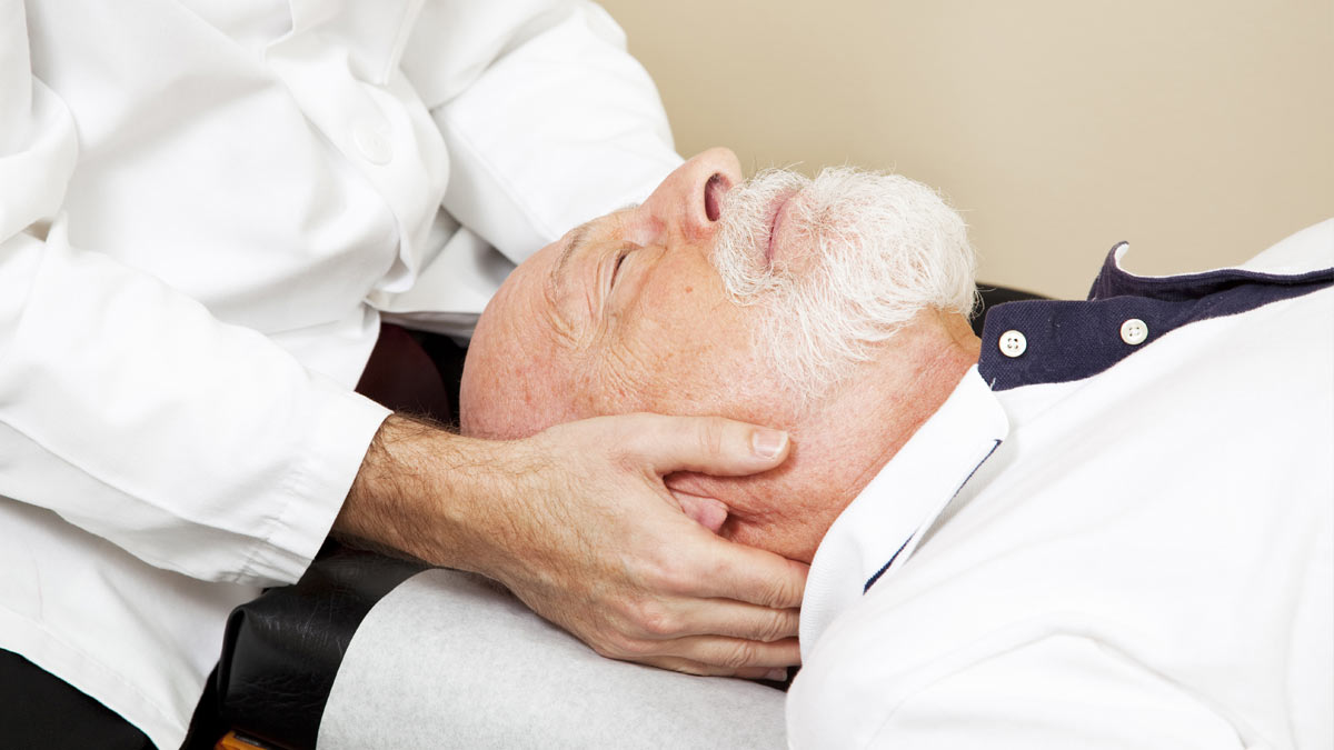 A man receiving a chiropractic adjustment