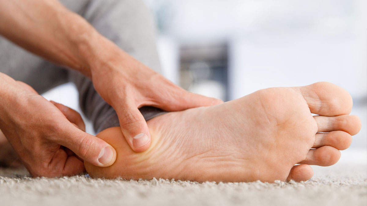 A doctor examines a patient's foot