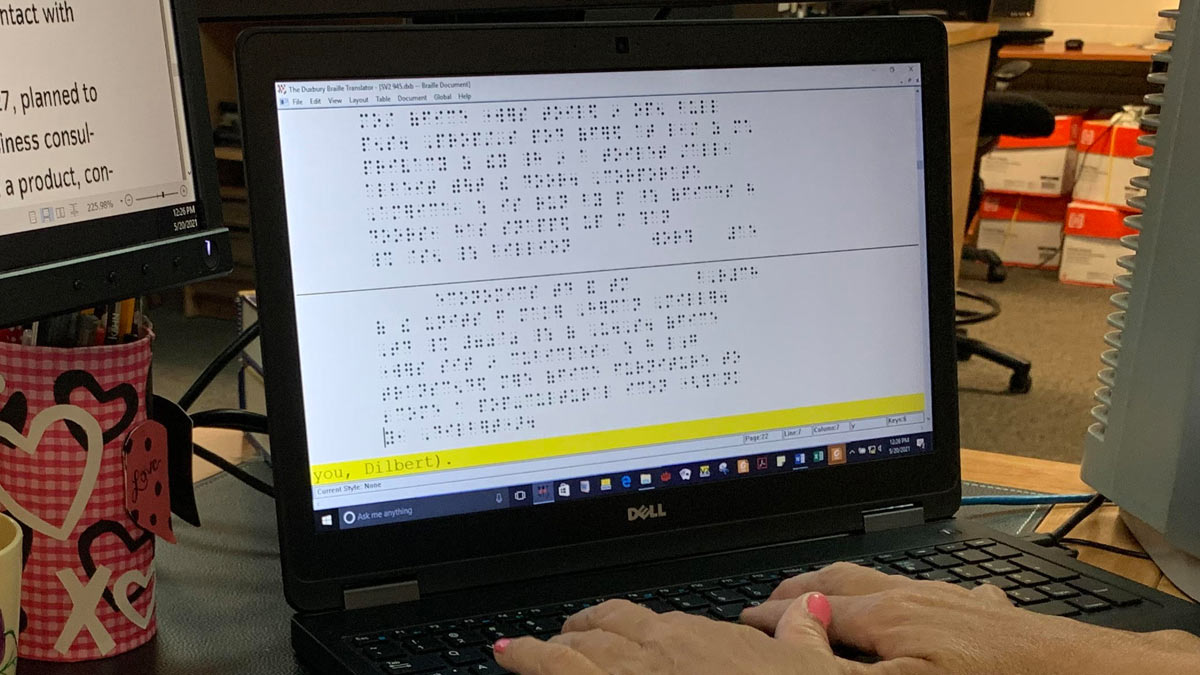 Braille as displayed on a laptop.