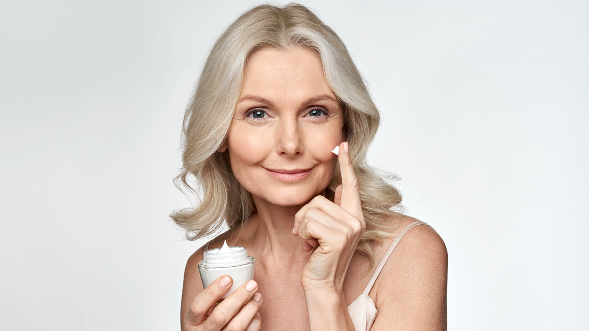 A woman with skin cream to prevent wrinkles.