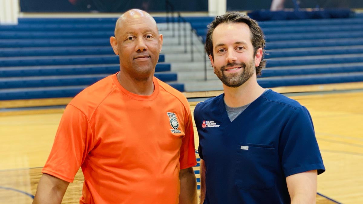 Jerome Stewart, a Timberland High School physical education teacher and basketball coach with Dr. Ben Schell, orthopedic spine surgeon, South Carolina Sports Medicine & Orthopedic Center.