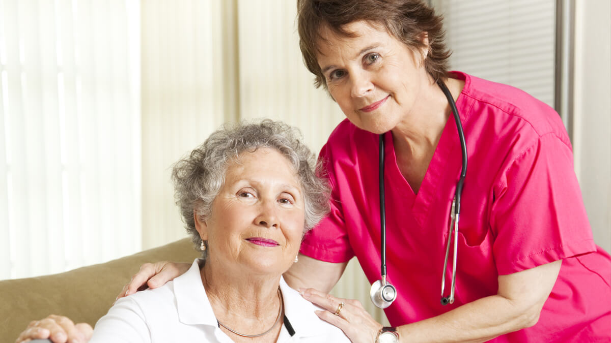 Staff from Comfort Keepers assisting senior