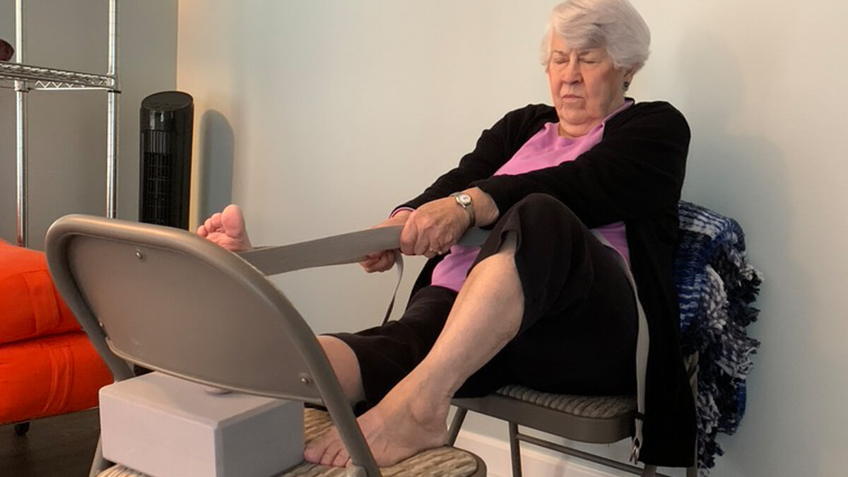 A disabled woman performing stretching exercise