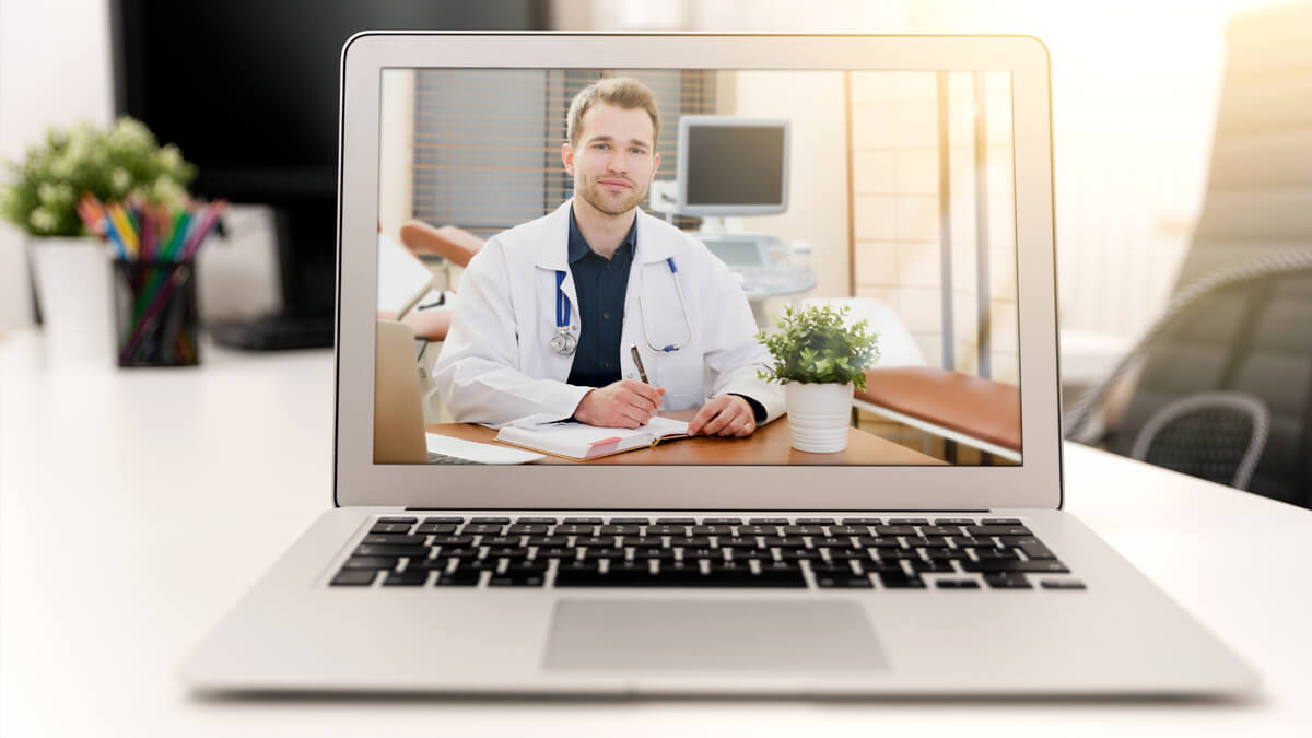 Doctor providing telehealth services through laptop