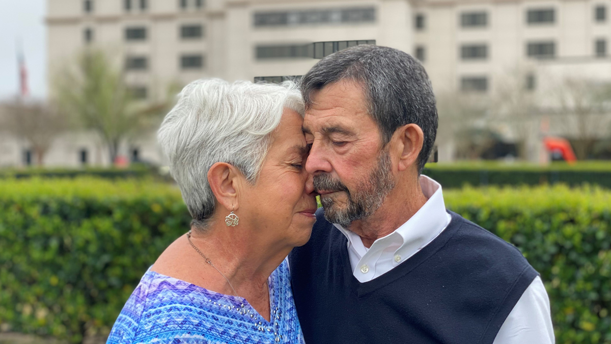 Pete Bazzle and his wife Penny embrace