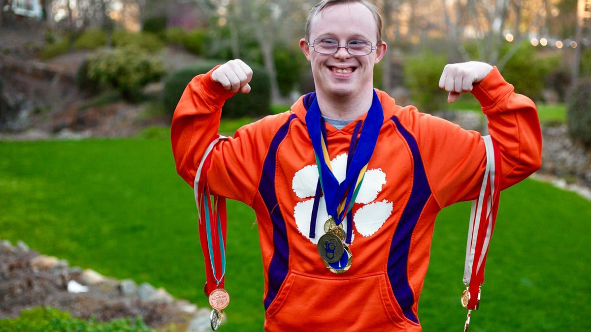 Photo of Rion Holcombe with his medals