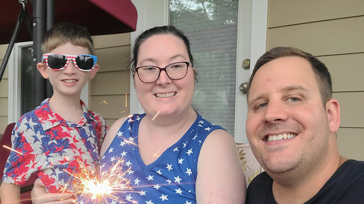 Photo of a family holding a sparkler.