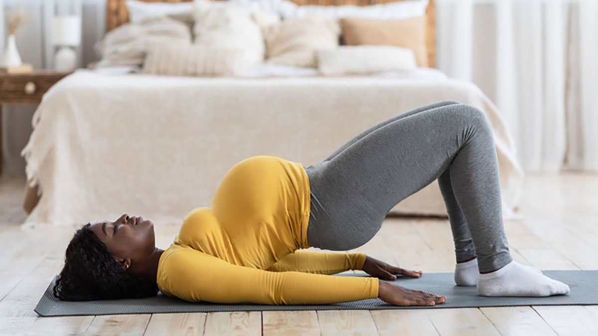 Photo of a woman who is pregnant doing an exercise