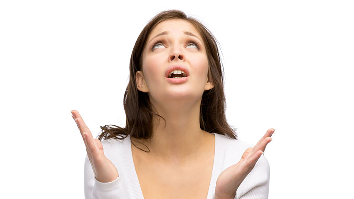 Photo of woman who is looking up with her hands up