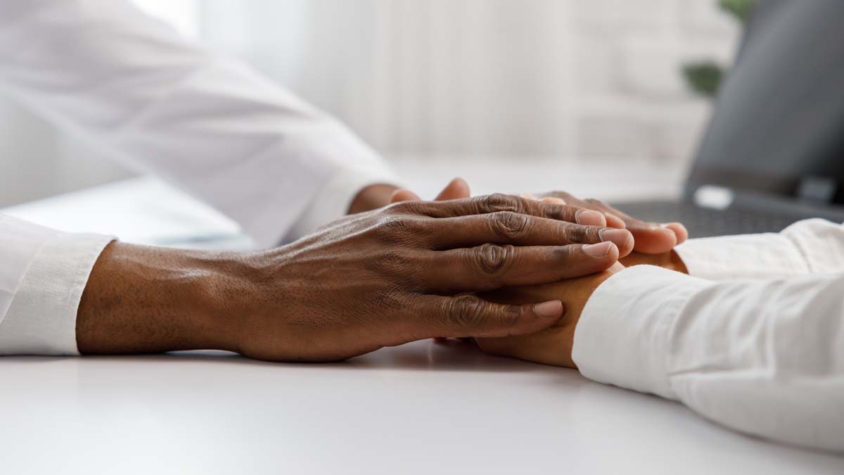 Photo of two hands touching