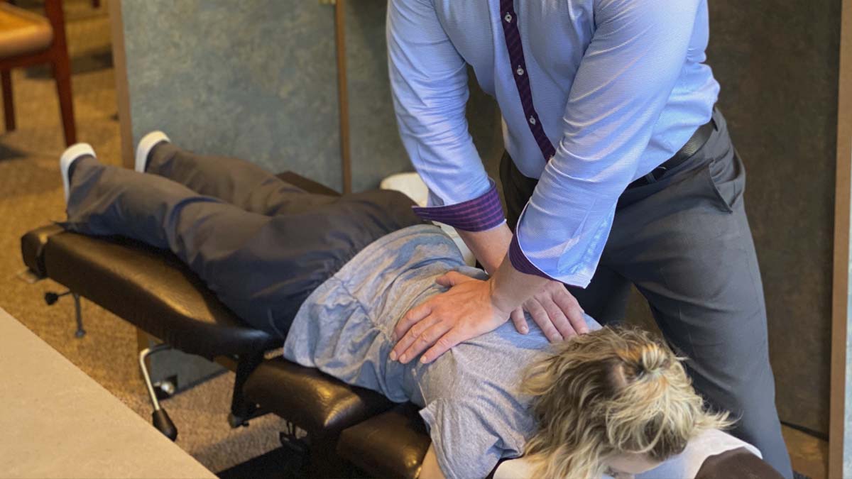 Photo of a woman in a Chiropractic's table