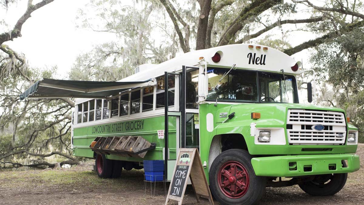 Photo of outside of a bus that is green