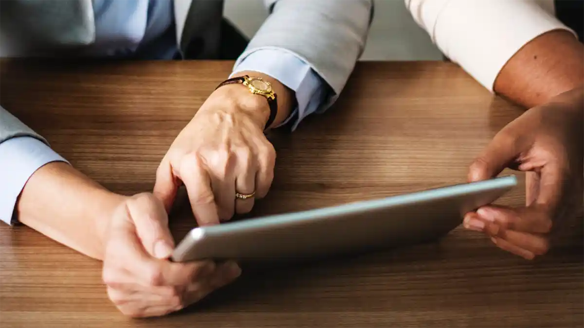 An insurance consultant reviews insurance options with a client.