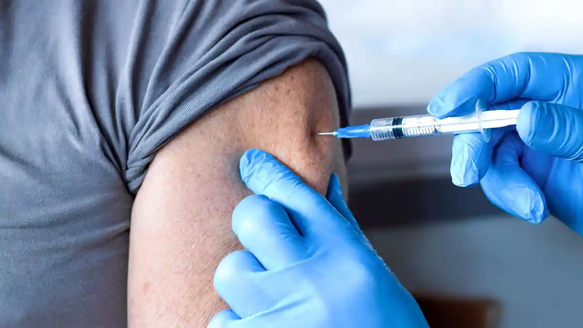 A man gets a flu shot at Herold's Pharmacy.