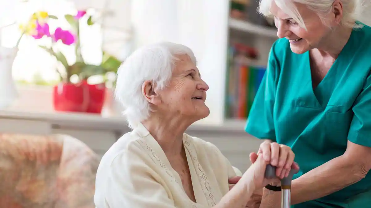 A Lutheran Hospice patient smiling with one of the staff members.