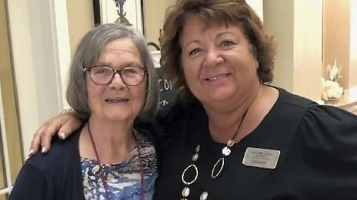 A happy resident and staff member smiling at Mount Pleasant Gardens in Mt Pleasant, SC.