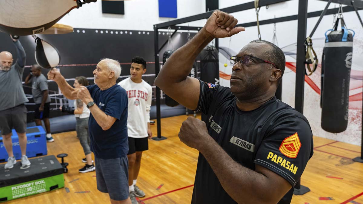 Photo of men working out at a gym