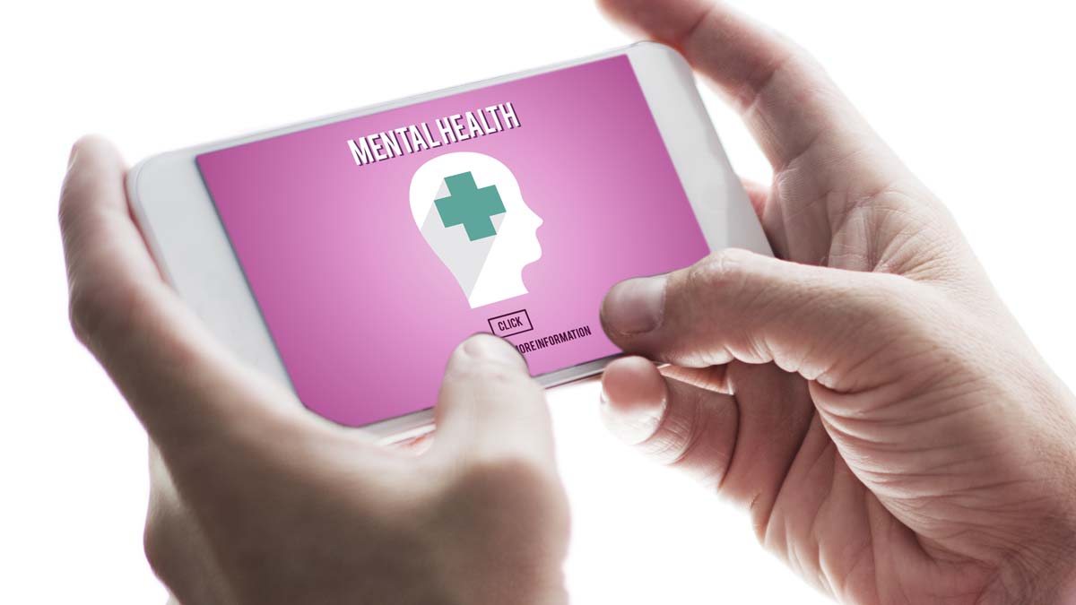 Photo of hands holding something that says mental health