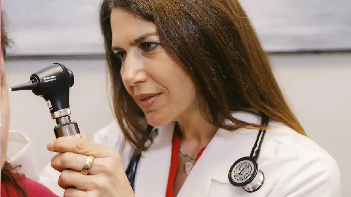 Dr. Erika Blank examines a patient.