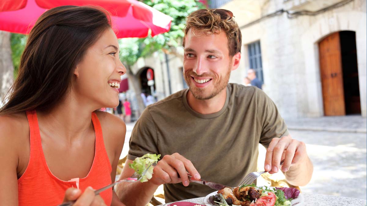 Photo of two people eating