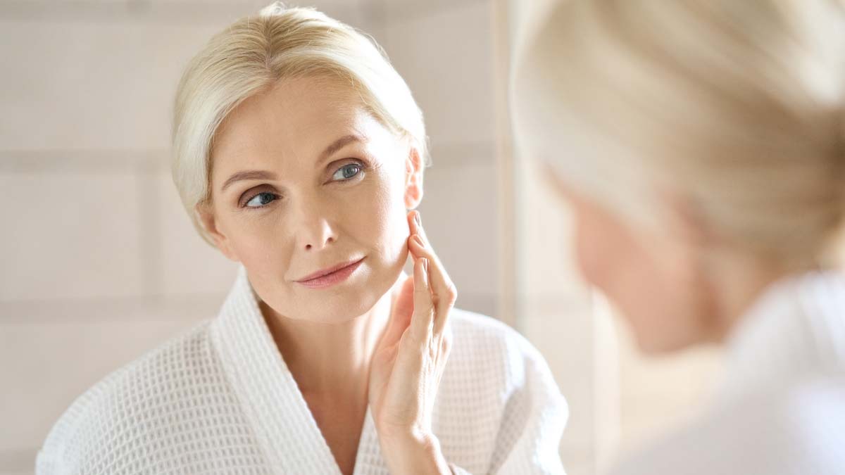 Photo of a woman looking in a mirror