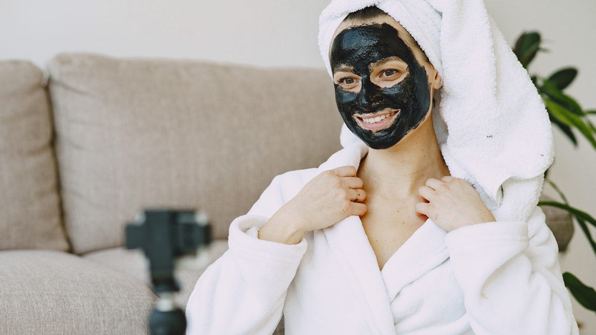 Photo of a woman with a skin care product on her face