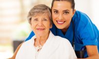 Photo of two women who are smiling