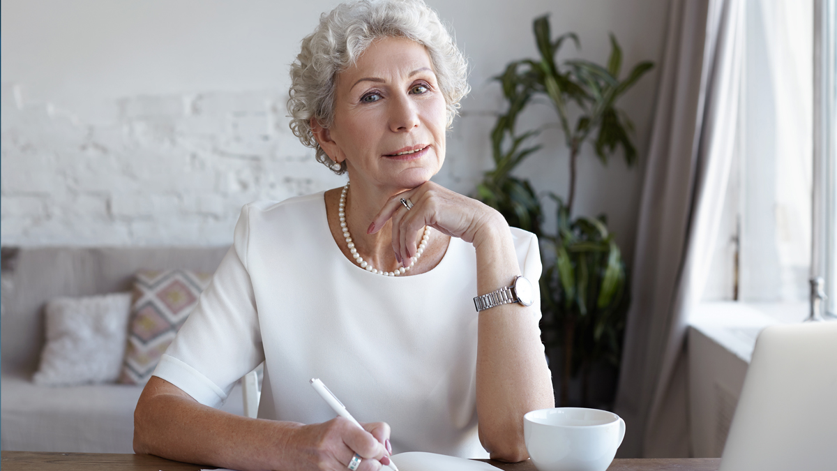 A photo of a woman with her hand under her chin