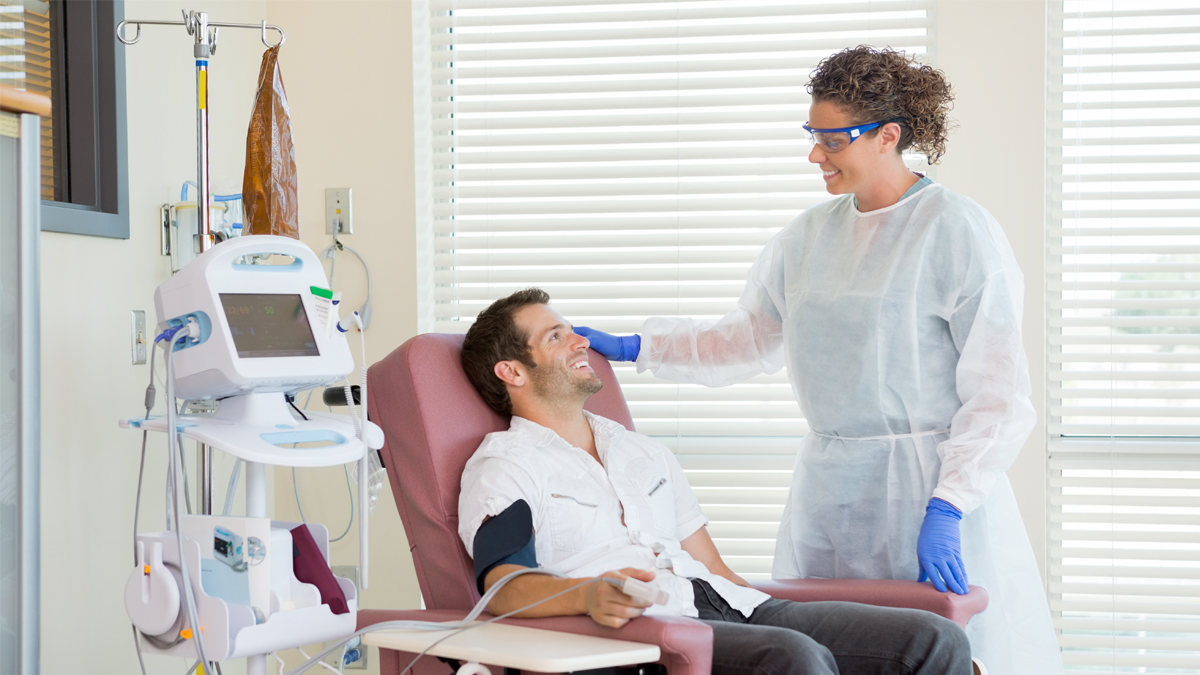 Photo of a doctor and a patient in a chair