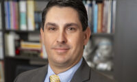 Headshot of a man in a suit